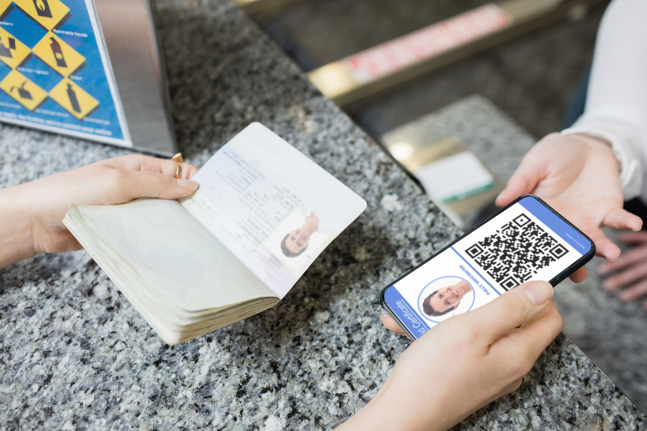 Woman At Airport Holding Documents And Smartphone With Covid
